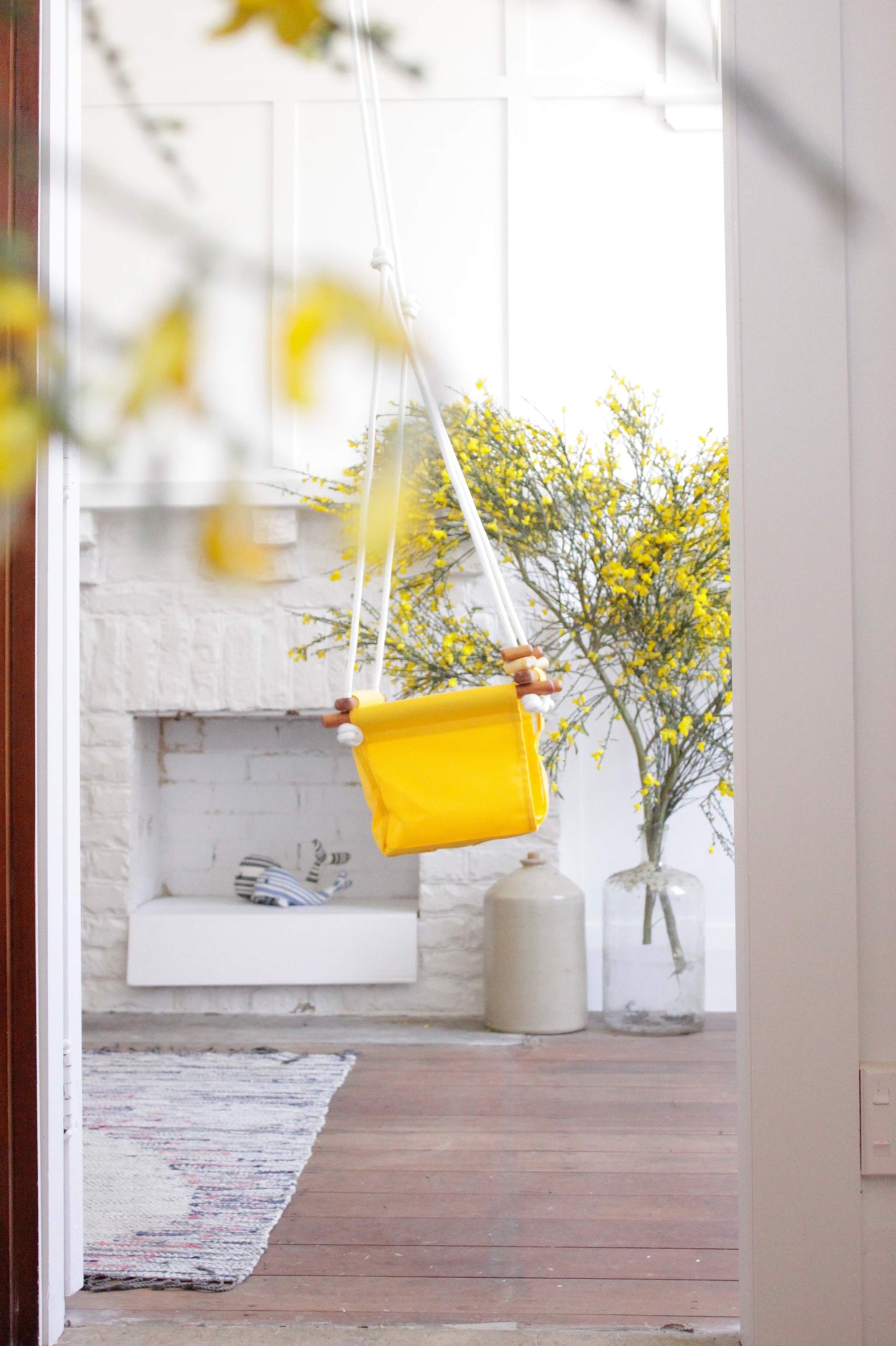Yellow indoor baby swing